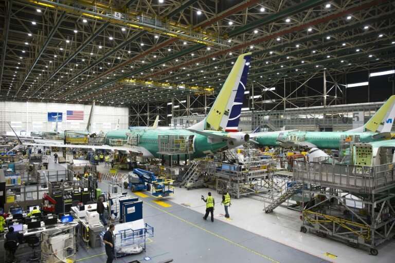 Employees work on Boeing 737 MAX airplanes at the factory in Renton, Washington