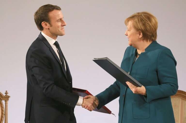 European news media associations wrote to French President Emmanuel Macron (L, pictured January 22, 2019) and German Chancellor 