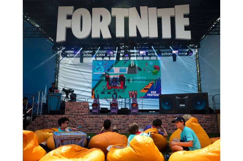 Fans rest on pillows at the 2019 Fortnite World Cup Finals - Round Two at the Arthur Ashe Stadium in New York City in July 2019