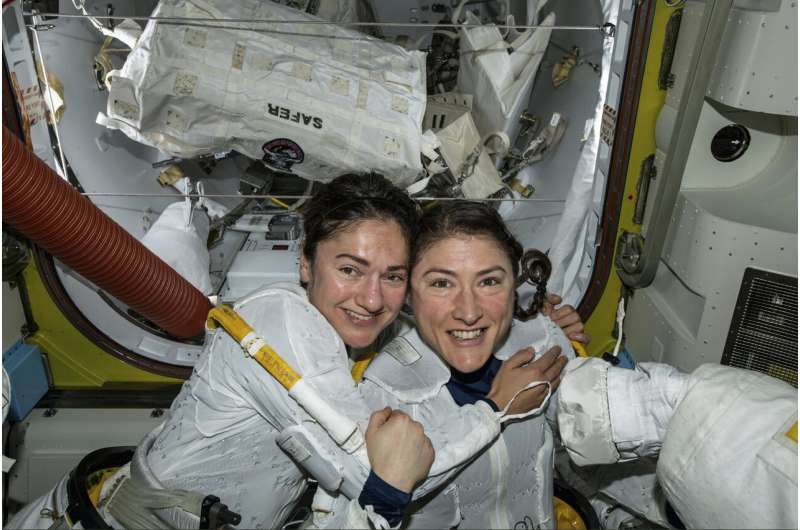 Female spacewalking duo uplifted by excitement below