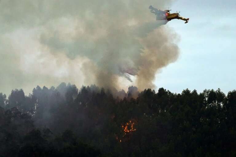 Firefighters were gaining the upper hand late Monday against dozens of wildfires