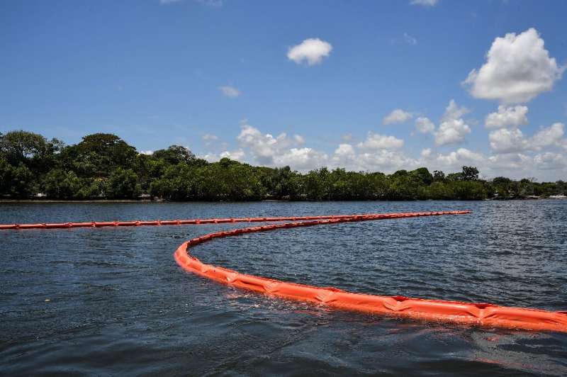 Floating barriers have been deployed to prevent crude spills from hitting idyllic beaches in Pernambuco state in the northeast