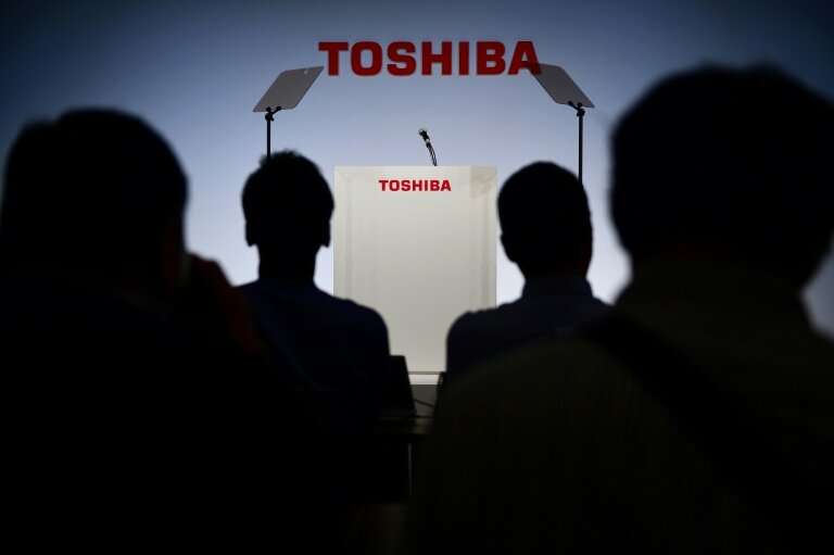 For the year to March, Toshiba said it now expects a net profit of 870 billion yen ($7.86 billion), down from a November estimat