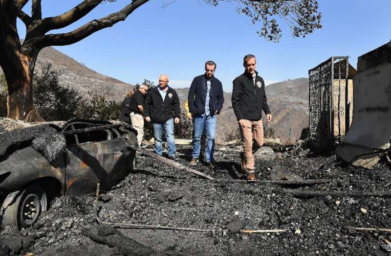 (FromR) LA Mayor Eric Garcetti, California Governor Gavin Newsom and LA City Councilman Mike Bonin view a burned home along Tige