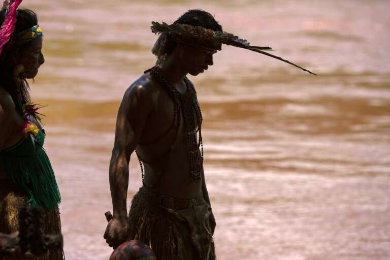 Hayo Pataxo ha-ha-hae, the 29-year-old leader of the indigenous community, looks at the Paraopeba river, filled with toxic mud f