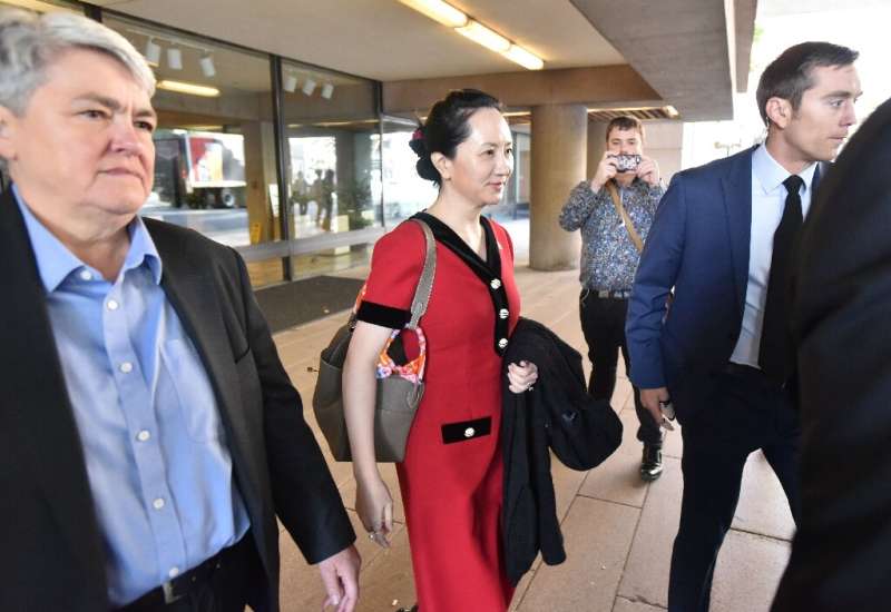 Huawei chief financial officer Meng Wanzhou (C) was arrested in 2018 during a flight stopover in Vancouver on a US warrant alleg
