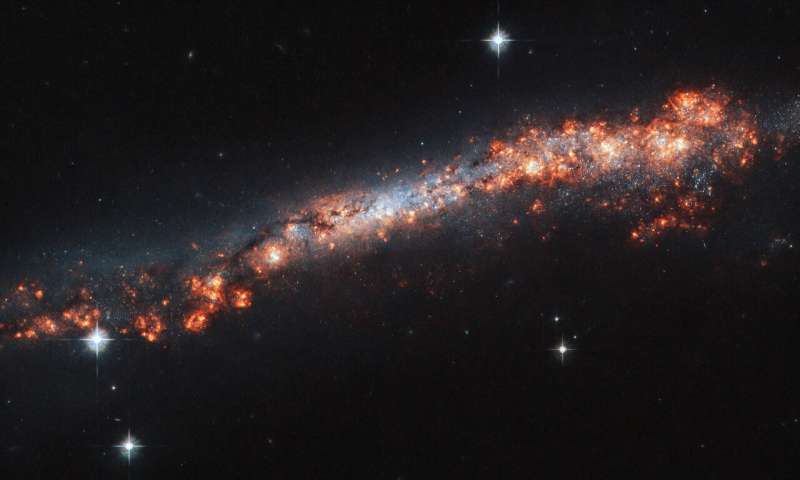 Hubble traces a galaxy’s outer reaches