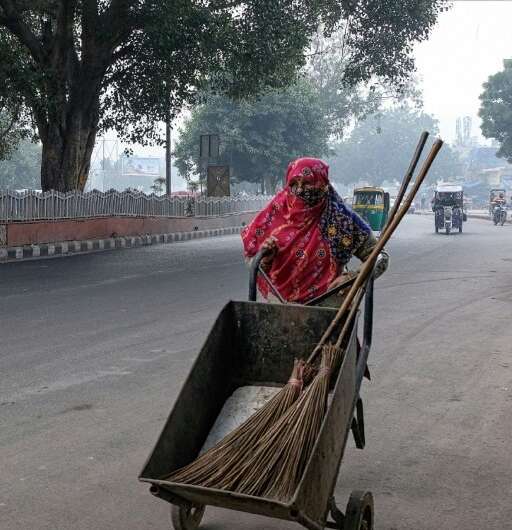 'I come at 6:30 in the morning. My eyes burn, I cough often,' says streetsweeper Lajwanti of working out side in Delhi's toxic a