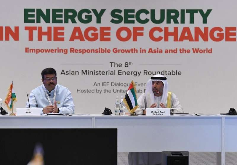 Indian Oil Minister Dharmendra Pradhan (L) listens as the United Arab Emirates Energy Minister Suheil al-Mazrouei (R ) addreses 
