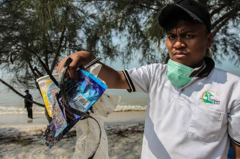 Indonesian volunteers and civil servants scoured beaches for plastic rubbish and other debris