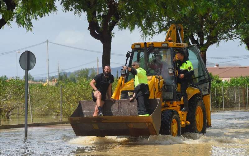 In flooded Redovan, some 50km (30 miles) southwest of Alicante, some people were being evacuated with diggers