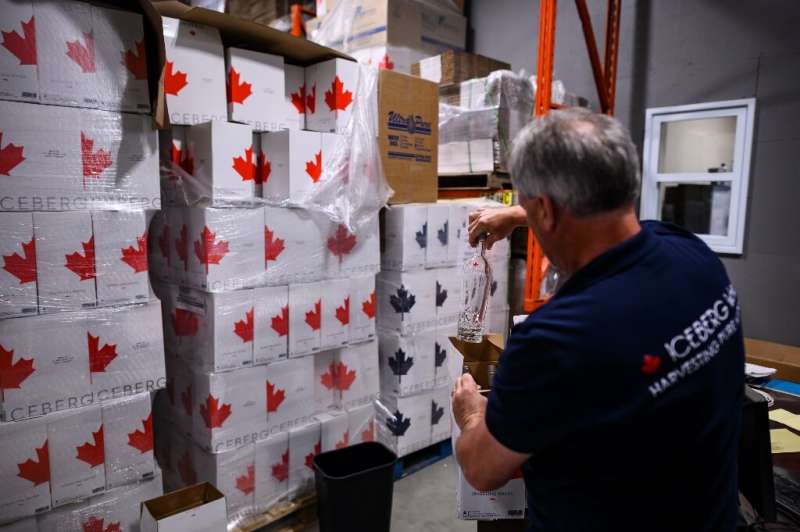 Kerry Chaulk, manager of Dyna Pro, which bottles iceberg water, packages a bottle in his factory in Lewisporte, Canada—his busin