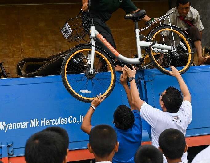 Mandalay entrepreneur Mike Than Tun Win bought up cycles from bike-sharing companies who had pulled out of Singapore and Malaysi