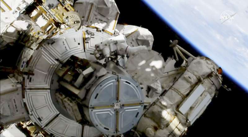 NASA conducting spacewalk as world's 1st spacewalker dies