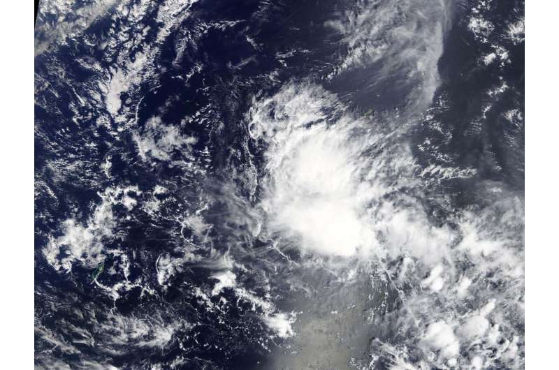 NASA sees development of Tropical Depression 03W near Yap