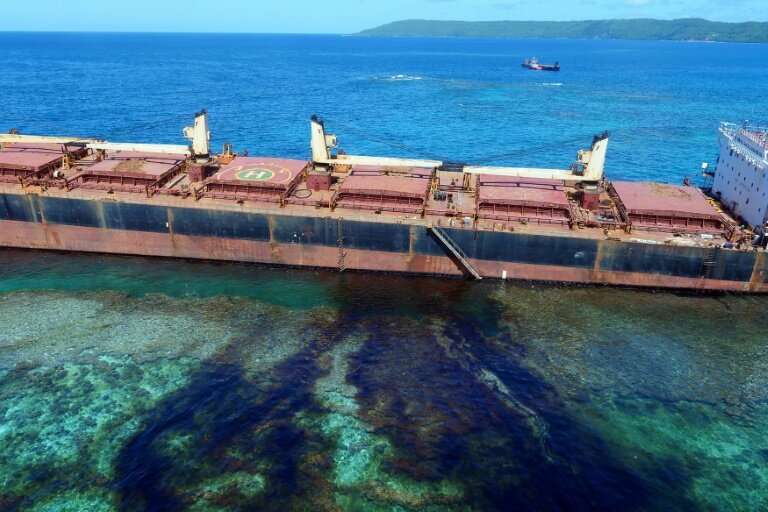 Oil is seen leaking from the MV Solomon Trader off the coast of Rennell Island, after the cargo vessel ran aground more than a m