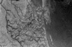 One of the first images of Titan, sent by the Huygens probe during its descent to the moon's surface in January 2005