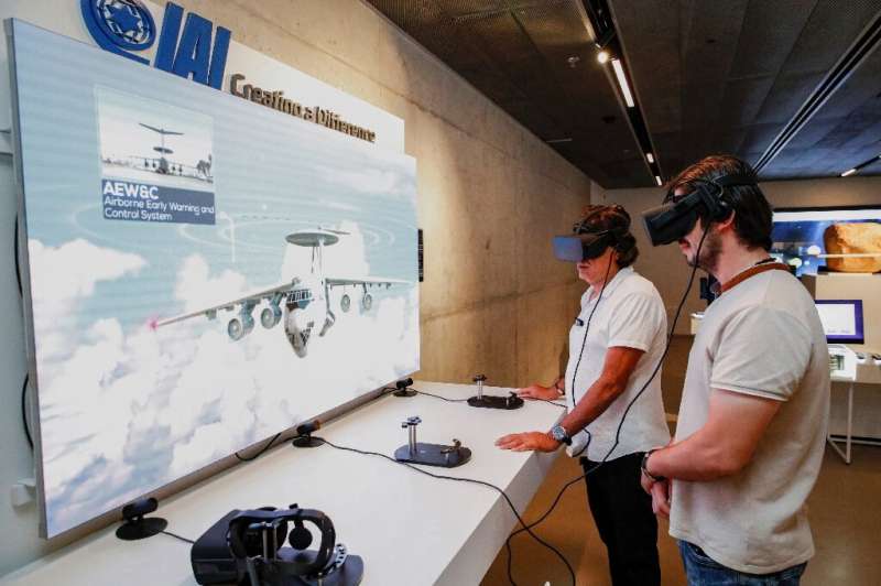 People visit displays of Israeli technology at the Peres Center for Peace and Innovation in the coastal city of Tel Aviv