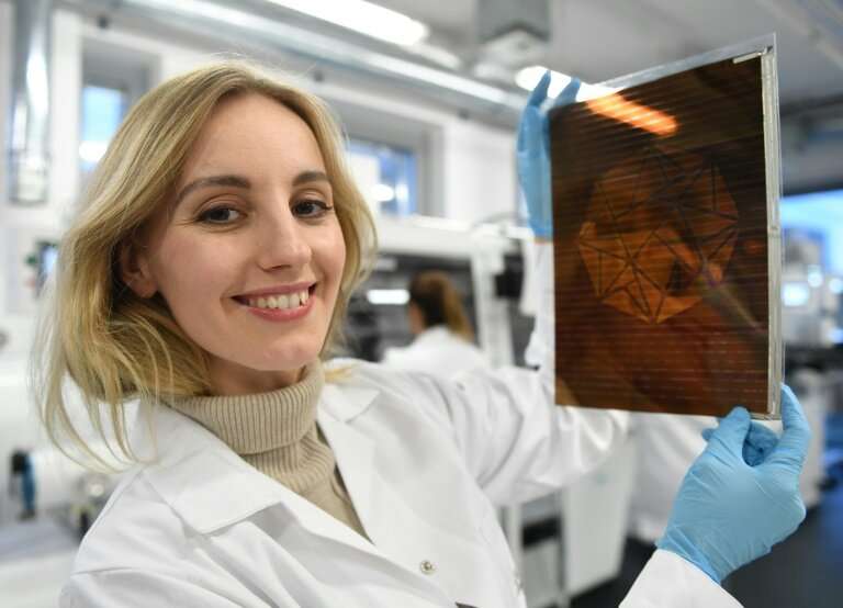 Polish physicist and businesswoman Olga Malinkiewicz poses with a printed solar panel