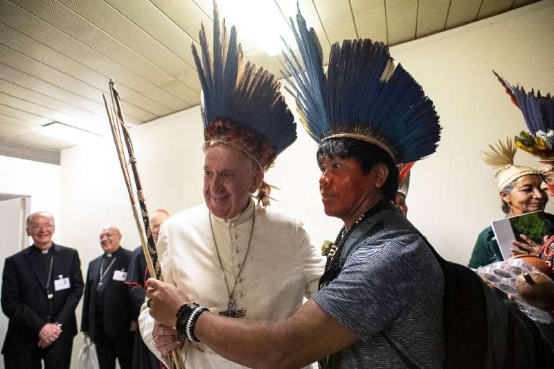 Pope Francis (L) is hosting the special three-week assembly of Catholic bishops on the Pan-Amazonian region