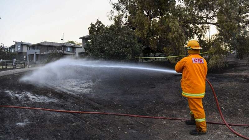 Residents and firefighters have been hosing down homes and land to stop the fires from spreading
