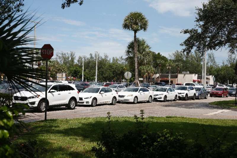 Residents line up for gas in preparation for Hurricane Dorian, in Pembroke Pines, Florida