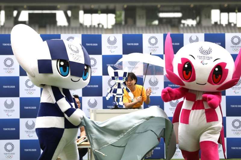 Robotic versions (C) of Tokyo's 2020 Olympic and Paralympic mascots— Miraitowa (left) and Someity—will have cameras inside their