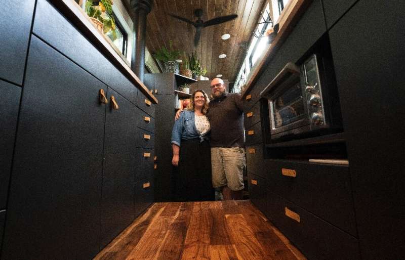 Scott Berrier and his wife Melissa—seen inside their tiny home in Elizabethtown, Pennsylvania—say they are happy with a more min