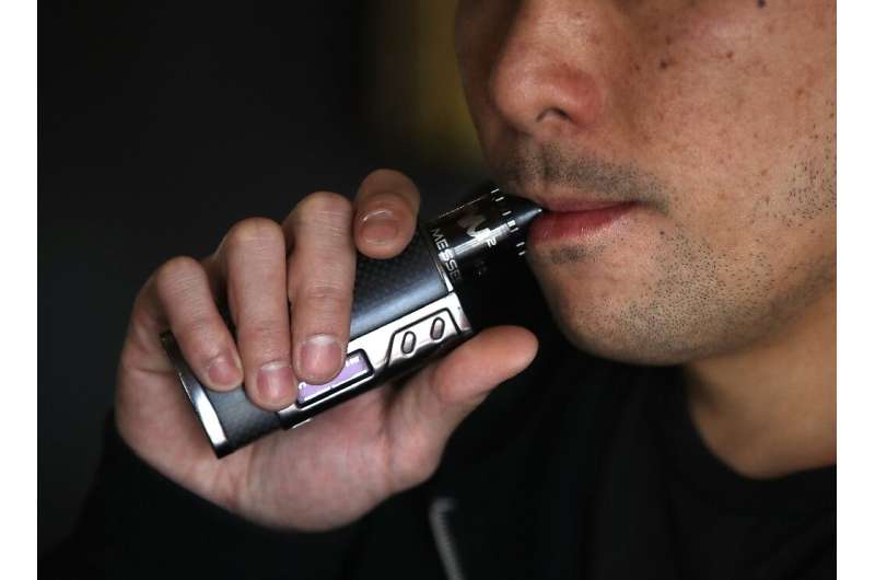 Smoker Jeremy Wong uses an e-cigarette at The Vaping Buddha, a boutique vaping shop in South San Francisco, California
