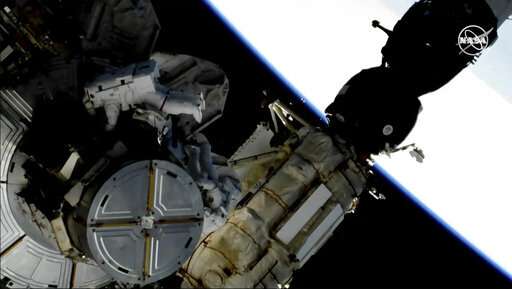 Spacewalking astronauts swap out space station's batteries