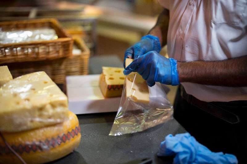Staff at a Budgens in north London cut cheese into slices and re-wrap it in sugarcane-made clingfilm