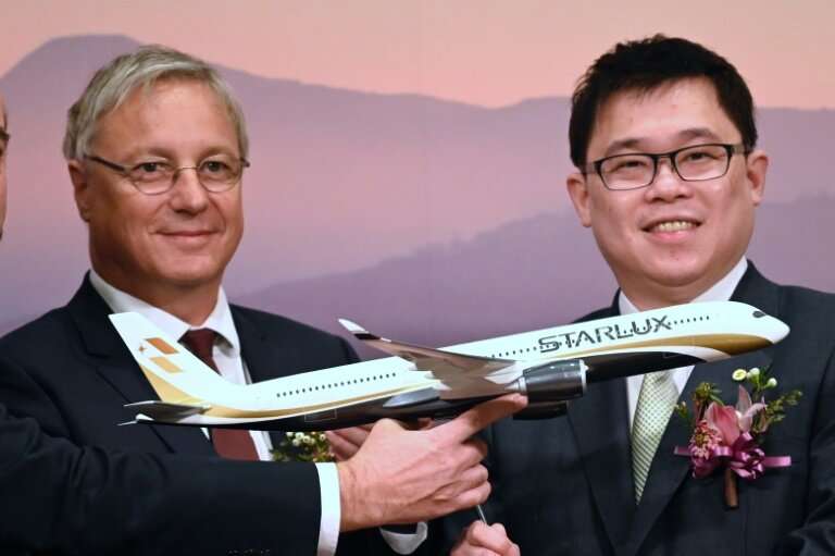 Starlux chairman Chang Kuo-wei, right, joined  Christian Scherer, Chief Commercial Officer of Airbus, for a signing ceremony in 