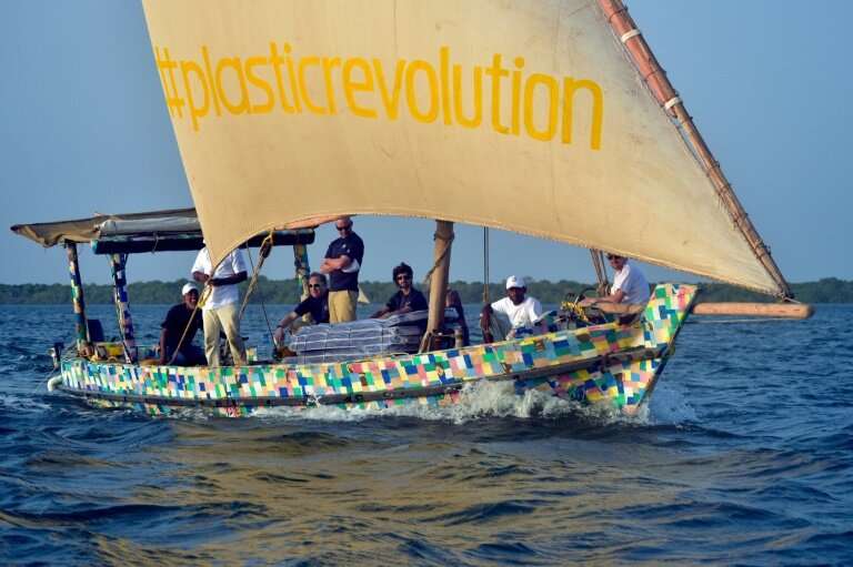 The boat is covered in a brightly-coloured patchwork of 30,000 flip-flops, which like the rest of the raw material was collected