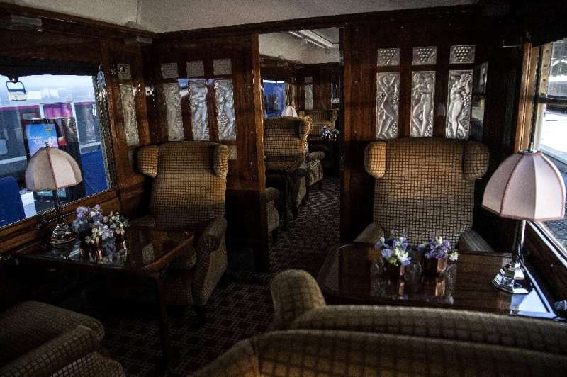 The grand interior of one of the restored carriages, complete with art deco fittings