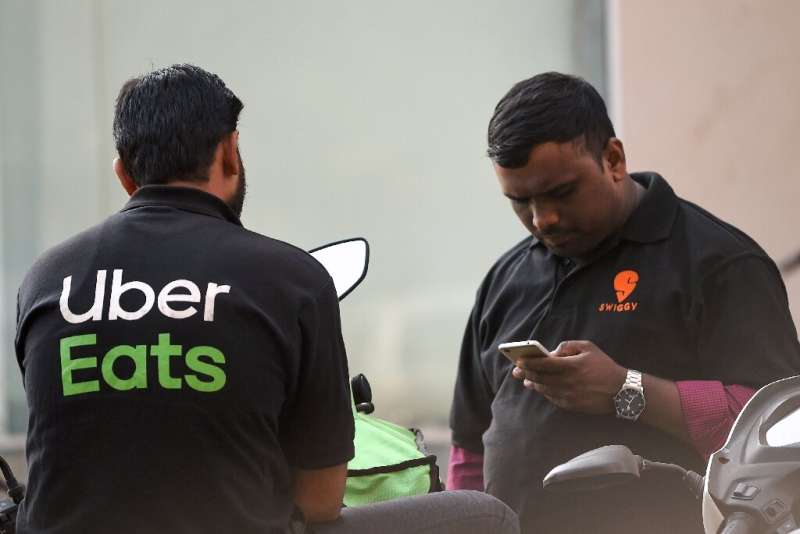 The green part of Uber Eats' logo, pictured here on a delivery driver, will be changed on the Marseille team's jersey after fans