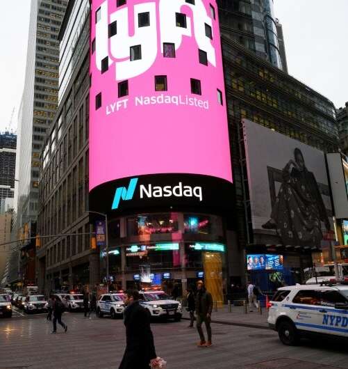 The Lyft logo is shown on the screen in Times Square after its stock debuted on Wall Street