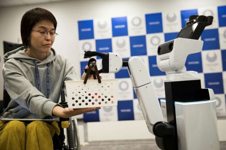 The robots are designed to help out disabled people enjoying the Games