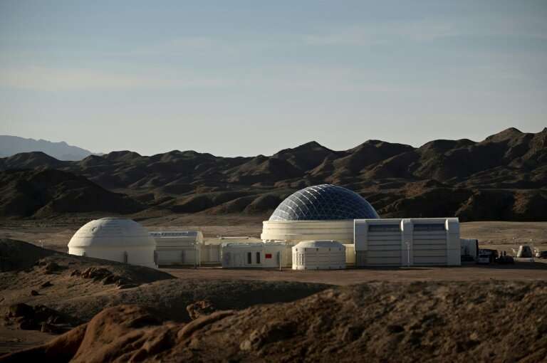 The white-coloured base has a silver dome and nine modules, including living quarters, a control room, a greenhouse and an airlo