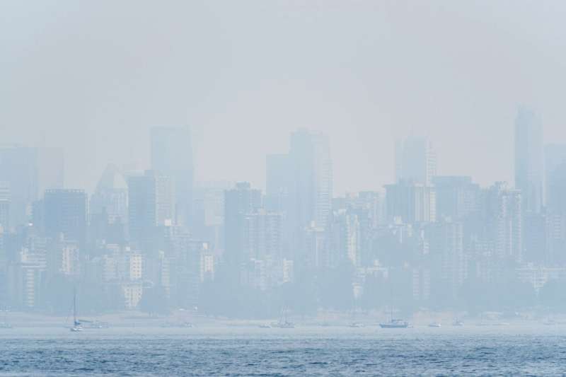 This file photo taken on August 21, 2018 shows heavy haze on the skyline of Vancouver, Canada as seen from Jericho Beach