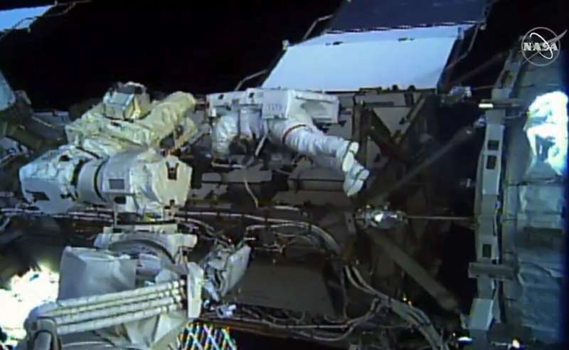 This image taken from NASA TV shows astronaut Christina Koch during a spacewalk outside the International Space Station on Octob