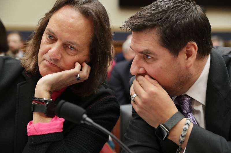 T-Mobile CEO John Legere and executive chairman of Sprint Marcelo Claure talk before testifying at the House of Representatives 