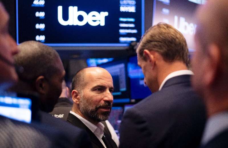 Uber CEO Dara Khosrowshahi talks to traders after the opening bell at the New York Stock Exchange where the ride-hailing giant's