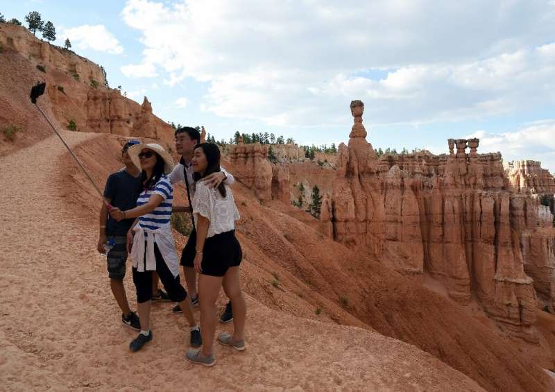 Visitors take a selfie in Bryce Canyon National Park, in the US state oi Utah