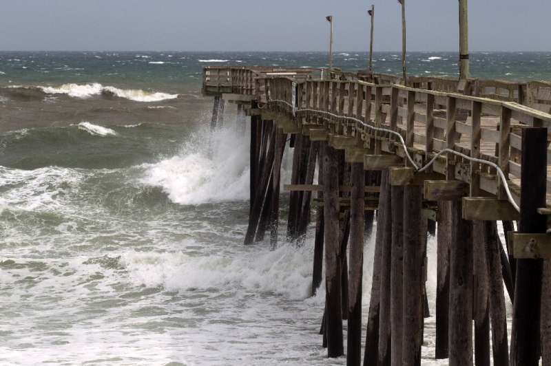 Waves crash as Hurricane Dorian make its way to Cape Hatteras in North Carolina, which the state's governor warned is facing a &