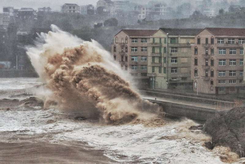 Waves hit a sea wall in Taizhou in China's eastern Zhejiang province, battered by Super Typhoon Lekima