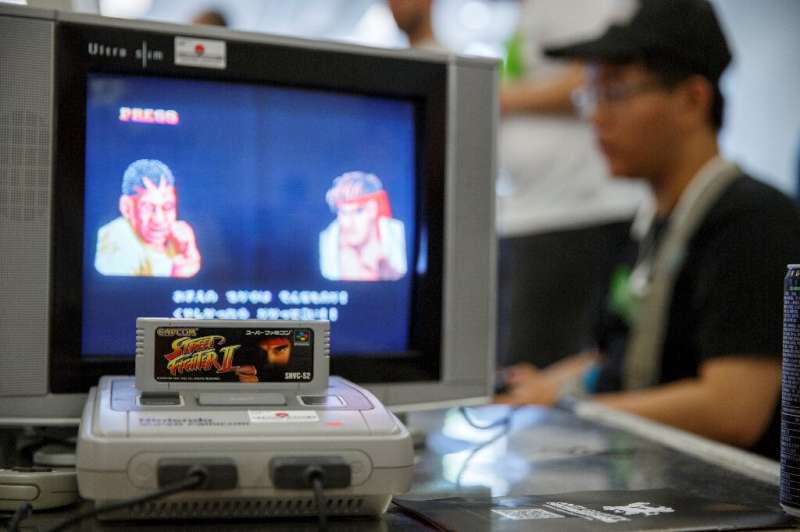 A group of Japanese retro gaming fans is offering 100 Super Nintendo consoles, similar to the one pictured here, to cooped-up ki