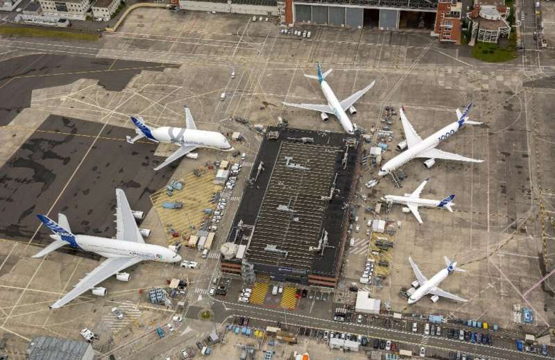 Airbus aircraft at the firm's Toulouse headquarters—the company supports hundreds of suppliers and service providers but the cor