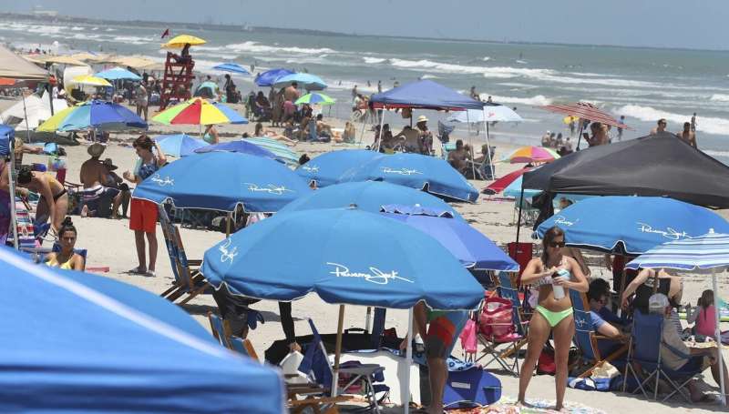Americans and Europeans soak up the sun amid new rules