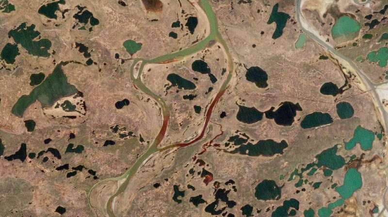 An aerial view of the fuel spill in the Ambarnaya River in the Arctic