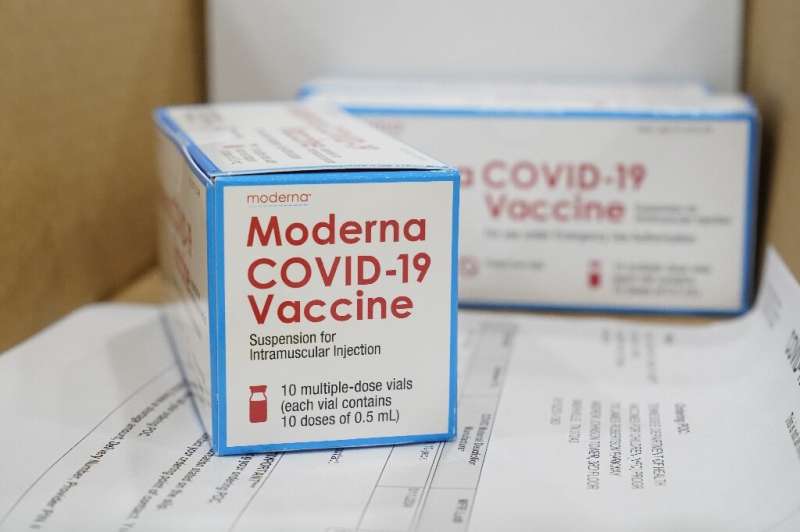Boxes containing the Moderna Covid-19 vaccine are prepared to be shipped at the McKesson distribution center in Olive Branch, Mi